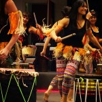 Dancers playing dunduns (stick drums)