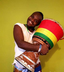 African man hugging his drum