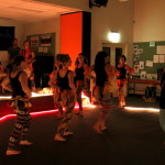 Dancers in bright leggings walking onto stage